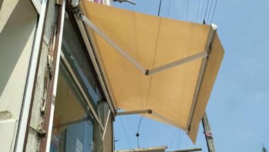 سایبان برقی بازویی نمای فروشگاه کرمانشاه